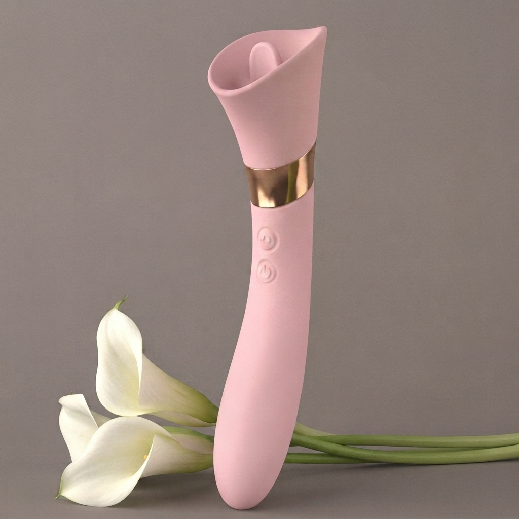 Petal air-pulse suction vibrator standing upright beside white calla lilies, blush pink silicone with gold ring on neutral background – Olyon