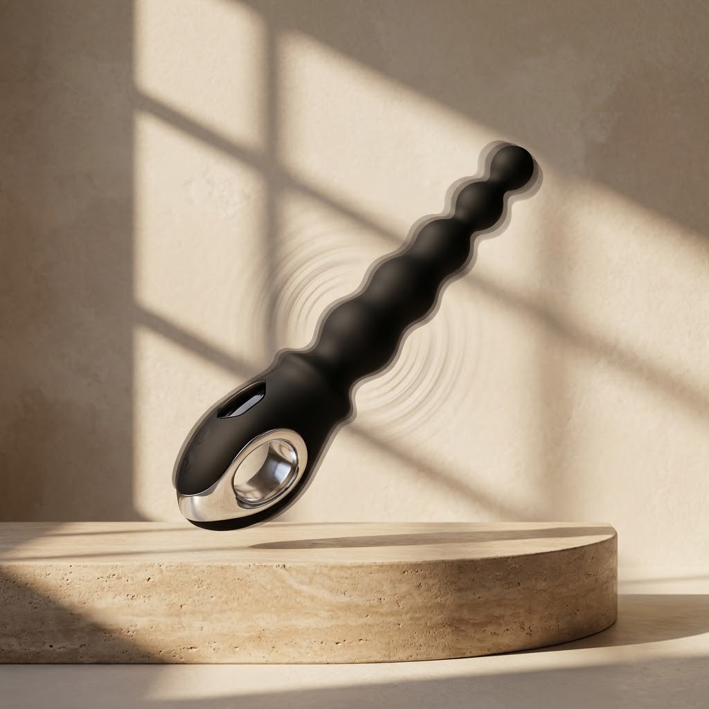 Velora black beaded vibrator displayed upright in sunlight
